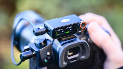 DJI Mic 2 receiver attached to a mirrorless camera